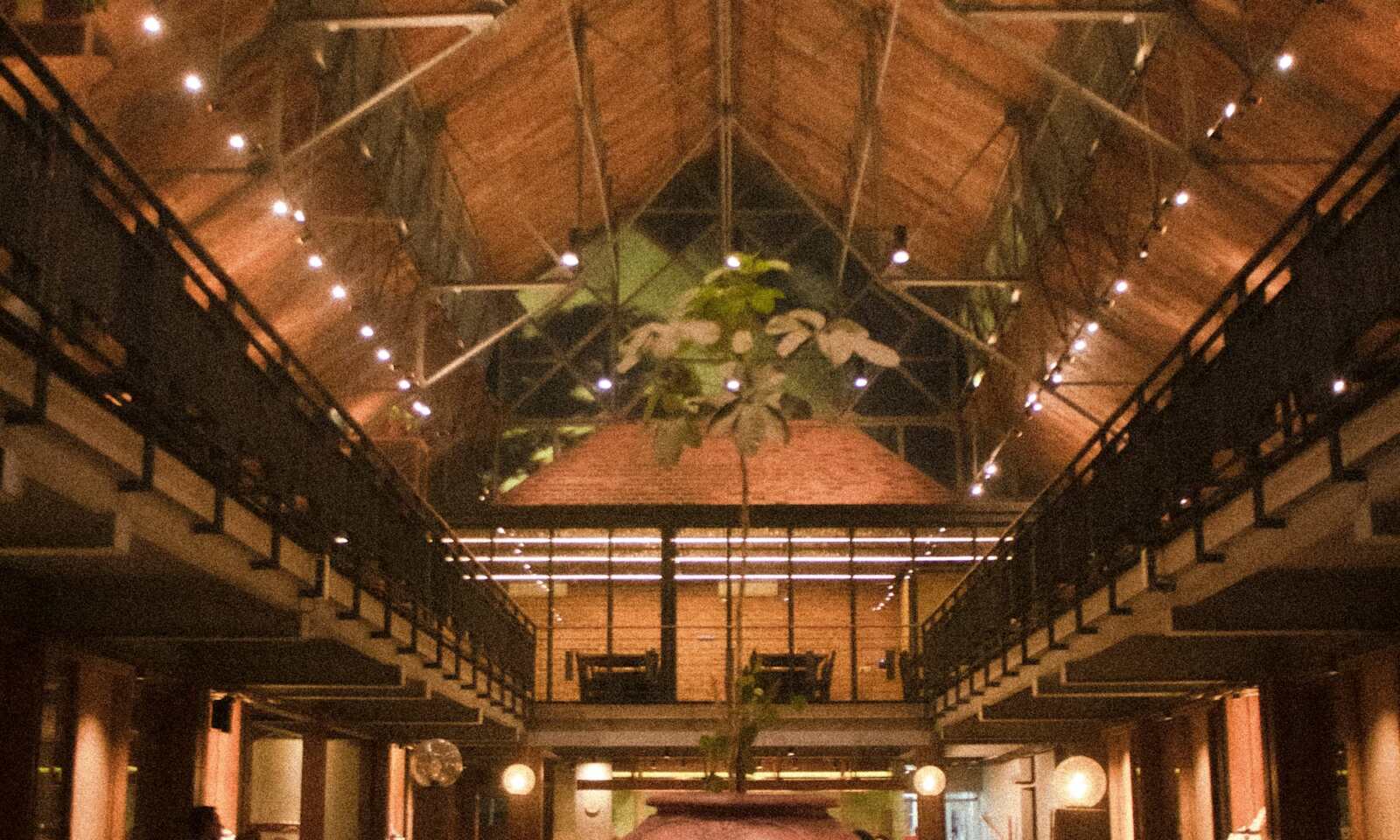 Warm rustic restaurant interior representing Kebun Bistro